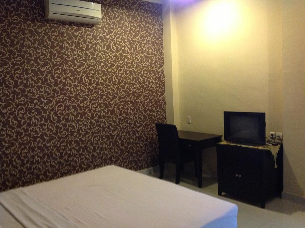 Carolina Transit Hotel Medan Quarto foto